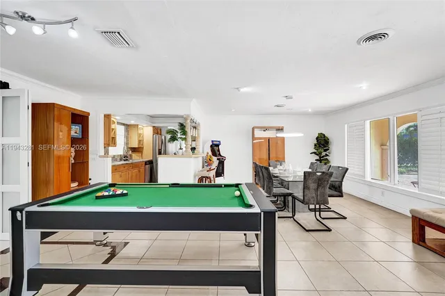 a kitchen with granite countertop dining table and chairs