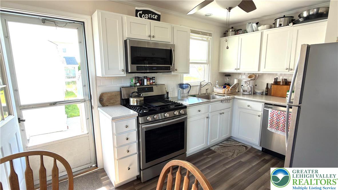 462 Maple Road Hellertown, PA 18055 - Photo 10 of 25 a kitchen with a stove a sink and a refrigerator