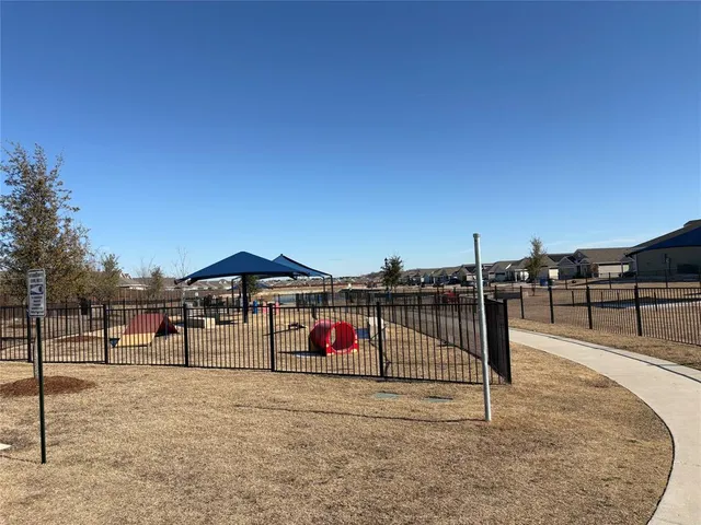 a view of a swimming pool with a bench