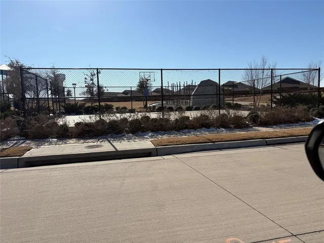a view of a street with sitting area