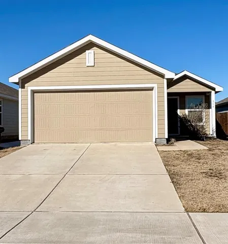 a front view of a house with a garage