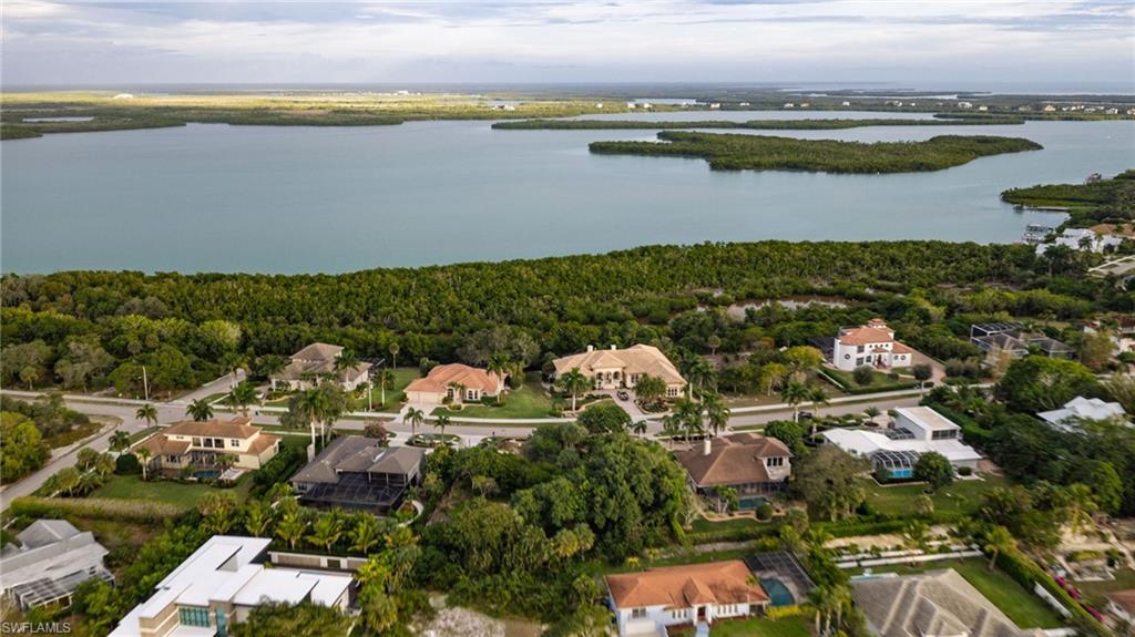 720 Inlet Drive Marco Island, FL 34145 - Photo 3 of 14 an aerial view of ocean with residential house with outdoor space and seating