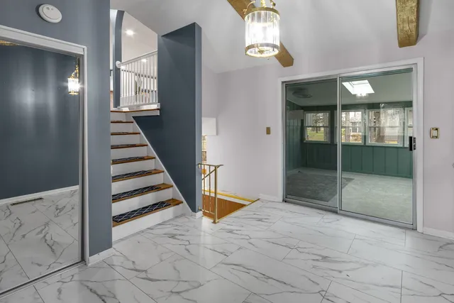 a house that has a tree in front of it