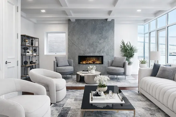 a living room with furniture fireplace and a large window