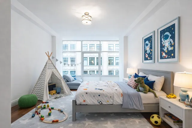 a bedroom with bed and a window