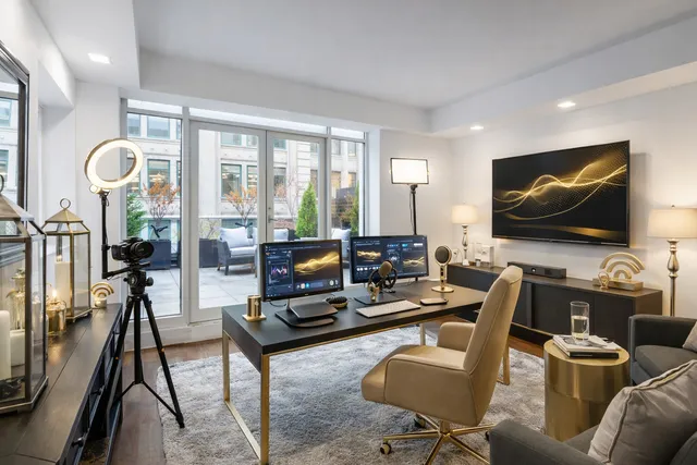 a living room with furniture gym equipment and a flat screen tv