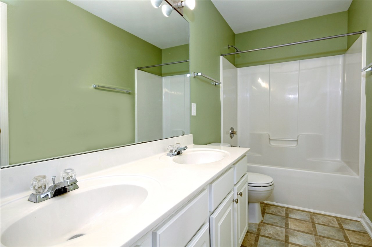 7444 Lagrange Drive Raleigh, NC 27613 - Photo 24 of 30 Full bathroom with tub/shower combo and dual vanity so no fighting over counter space while getting ready! Bathroom