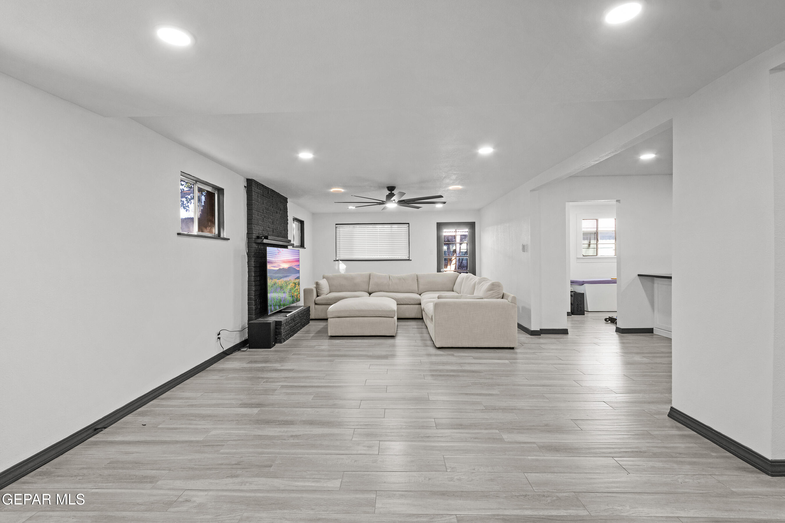 3425 Rutherglen Street El Paso, TX 79925 - Photo 15 of 34 a living room with furniture and a wooden floor