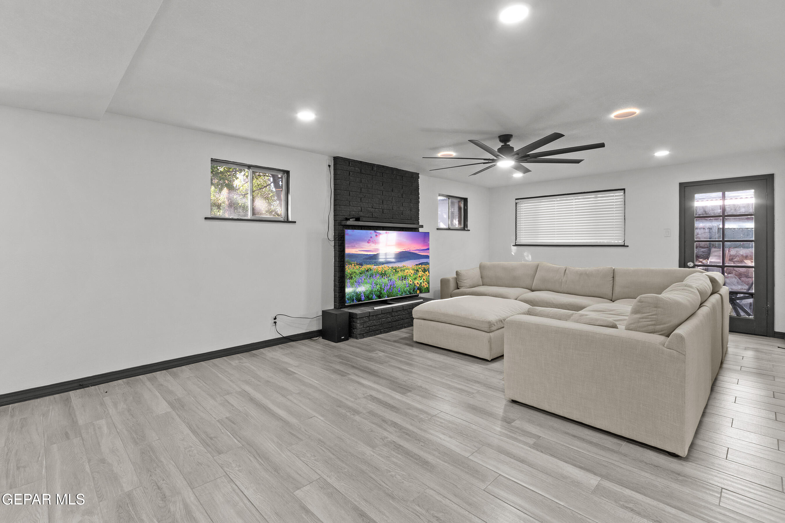 3425 Rutherglen Street El Paso, TX 79925 - Photo 16 of 34 a living room with furniture and a flat screen tv