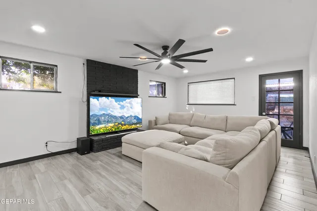 a living room with furniture and a flat screen tv