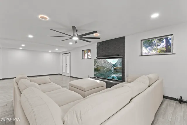 a living room with furniture and a large window