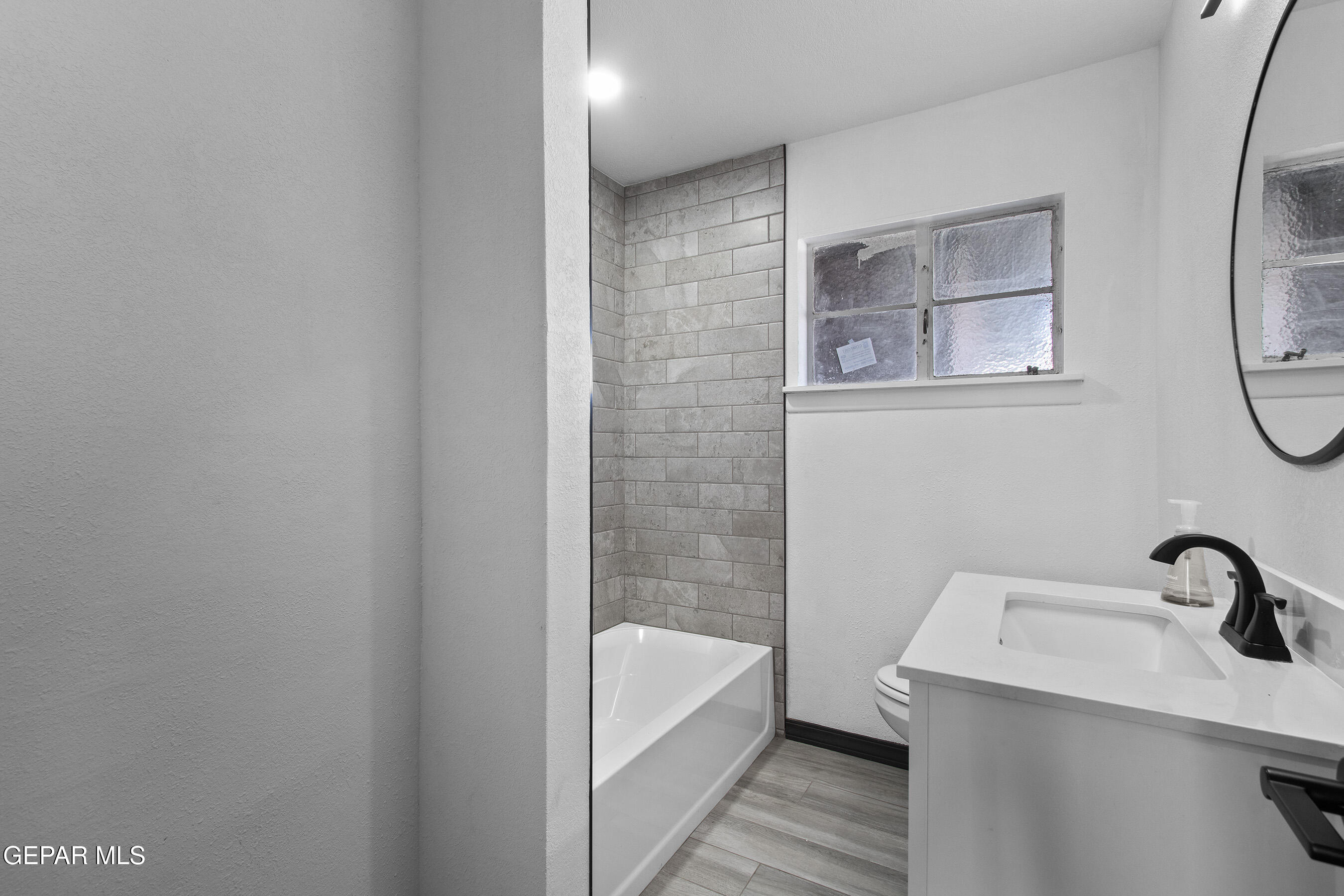 3425 Rutherglen Street El Paso, TX 79925 - Photo 25 of 34 a bathroom with a sink and a bathtub
