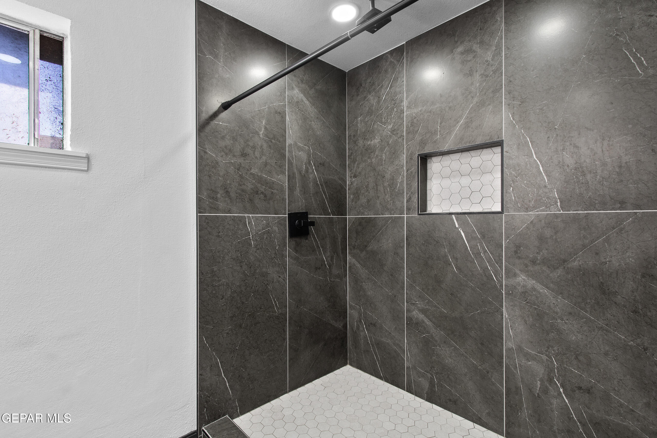 3425 Rutherglen Street El Paso, TX 79925 - Photo 31 of 34 a bathroom with a shower