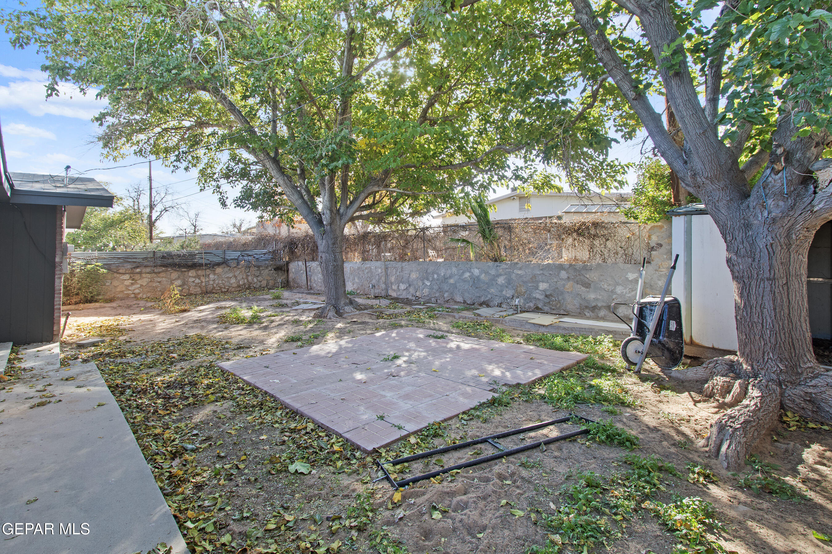 3425 Rutherglen Street El Paso, TX 79925 - Photo 33 of 34 a view of a backyard with large trees