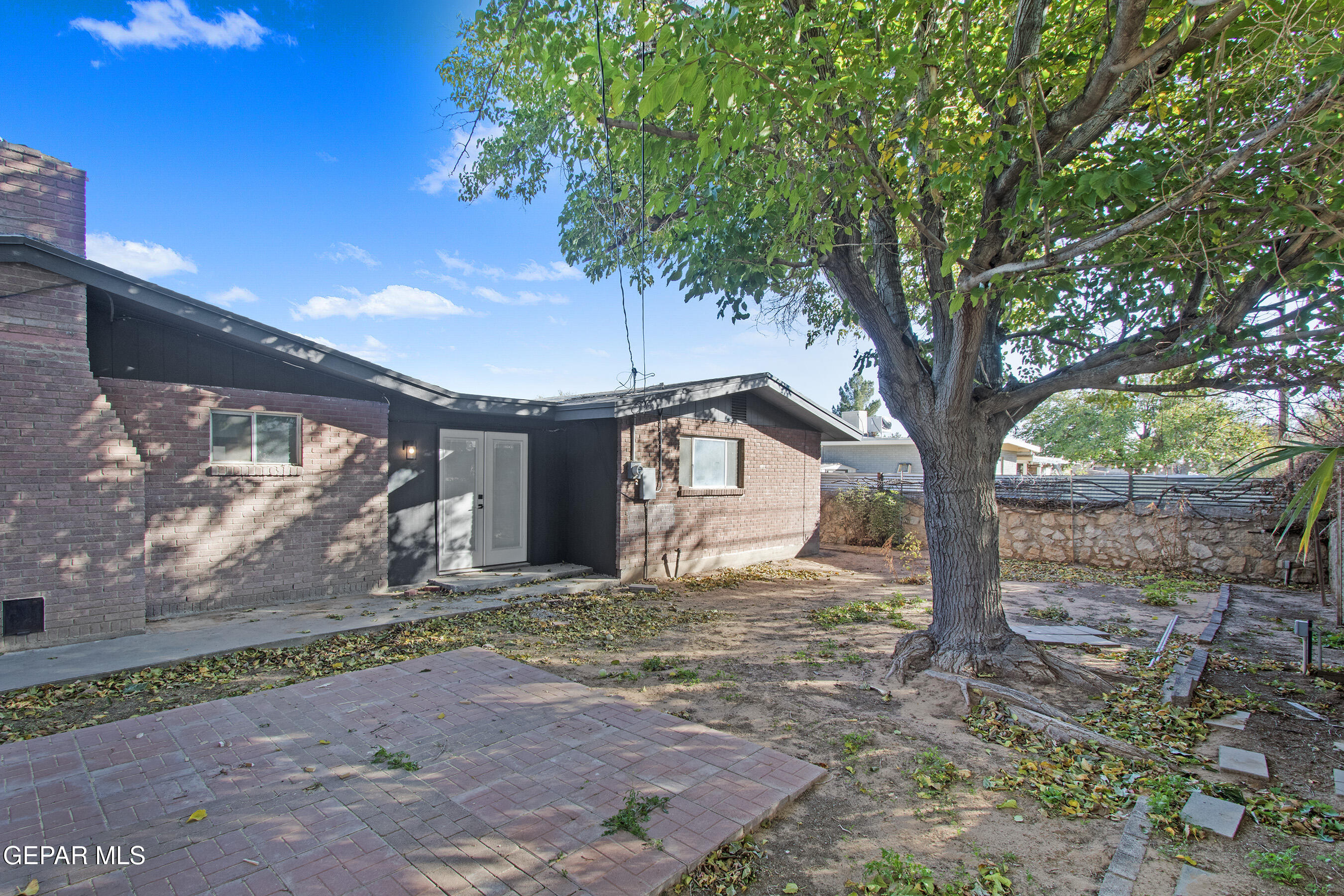 3425 Rutherglen Street El Paso, TX 79925 - Photo 34 of 34 a white house that has a tree in front of it