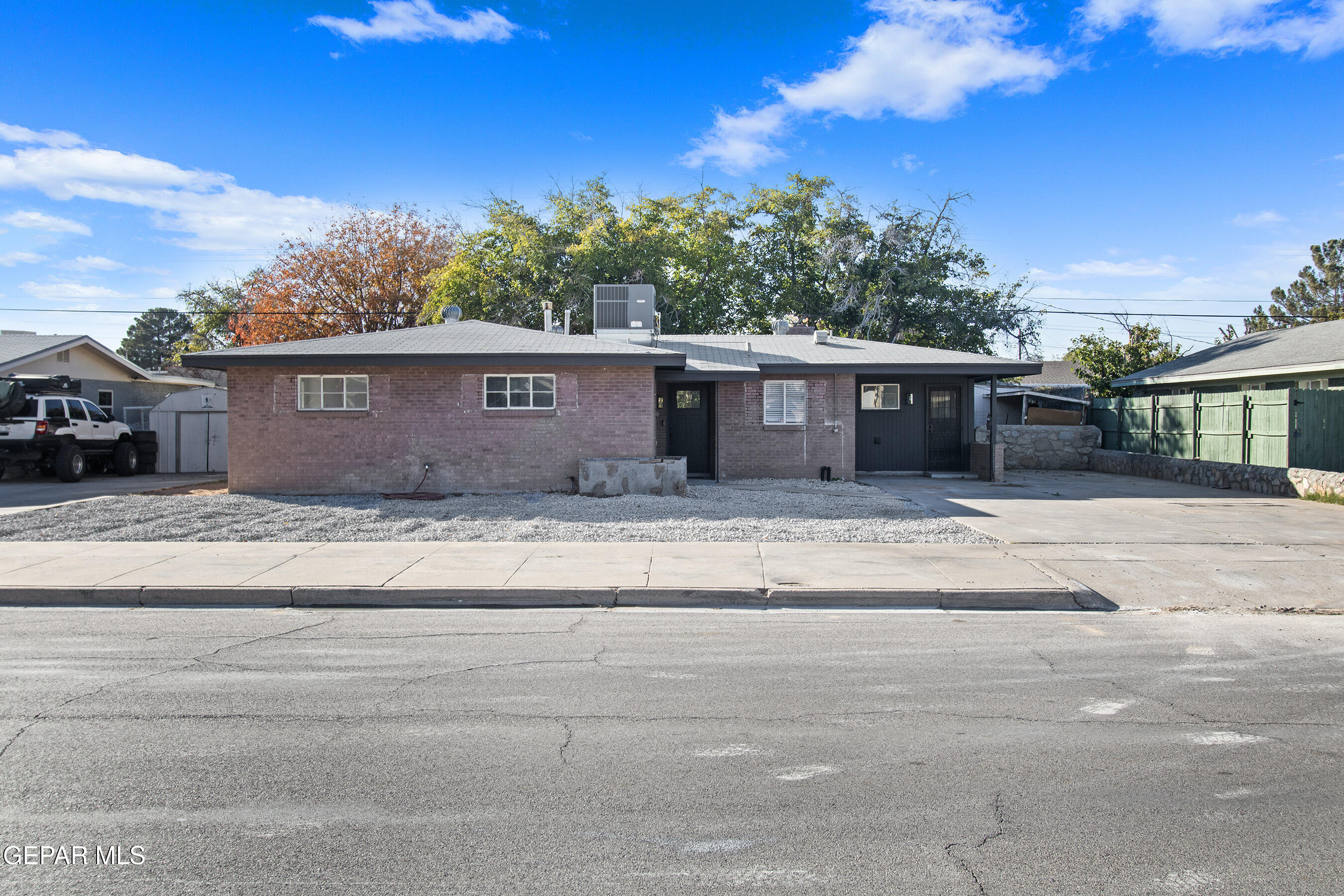 3425 Rutherglen Street El Paso, TX 79925 - Photo 4 of 34 a front view of a house with a garden