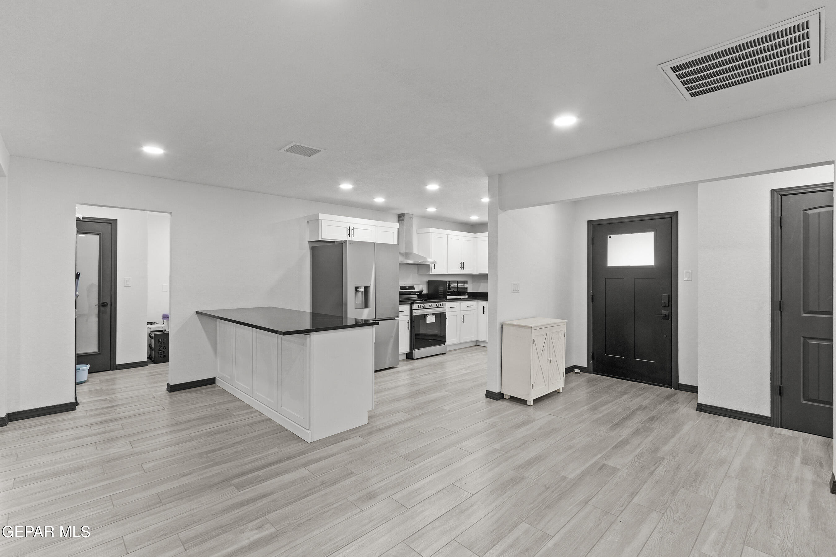 3425 Rutherglen Street El Paso, TX 79925 - Photo 5 of 34 a view of kitchen with refrigerator and wooden floor