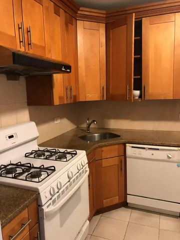 a kitchen with a stove and a microwave