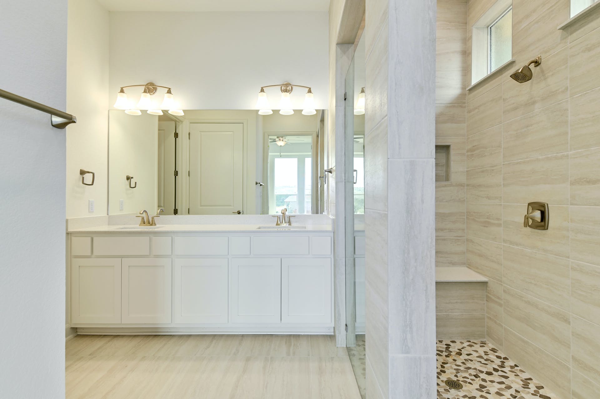 19005 Fernando Trail Austin, TX 78738 - Photo 20 of 35 Full bathroom featuring plenty of natural light, double vanity, and walk in shower