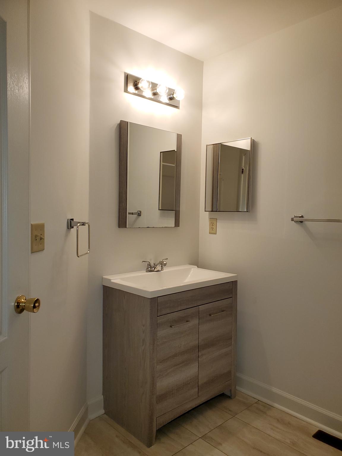 211 Bonnybrook Road Middletown, DE 19709 - Photo 11 of 16 a bathroom with a double vanity sink and mirror