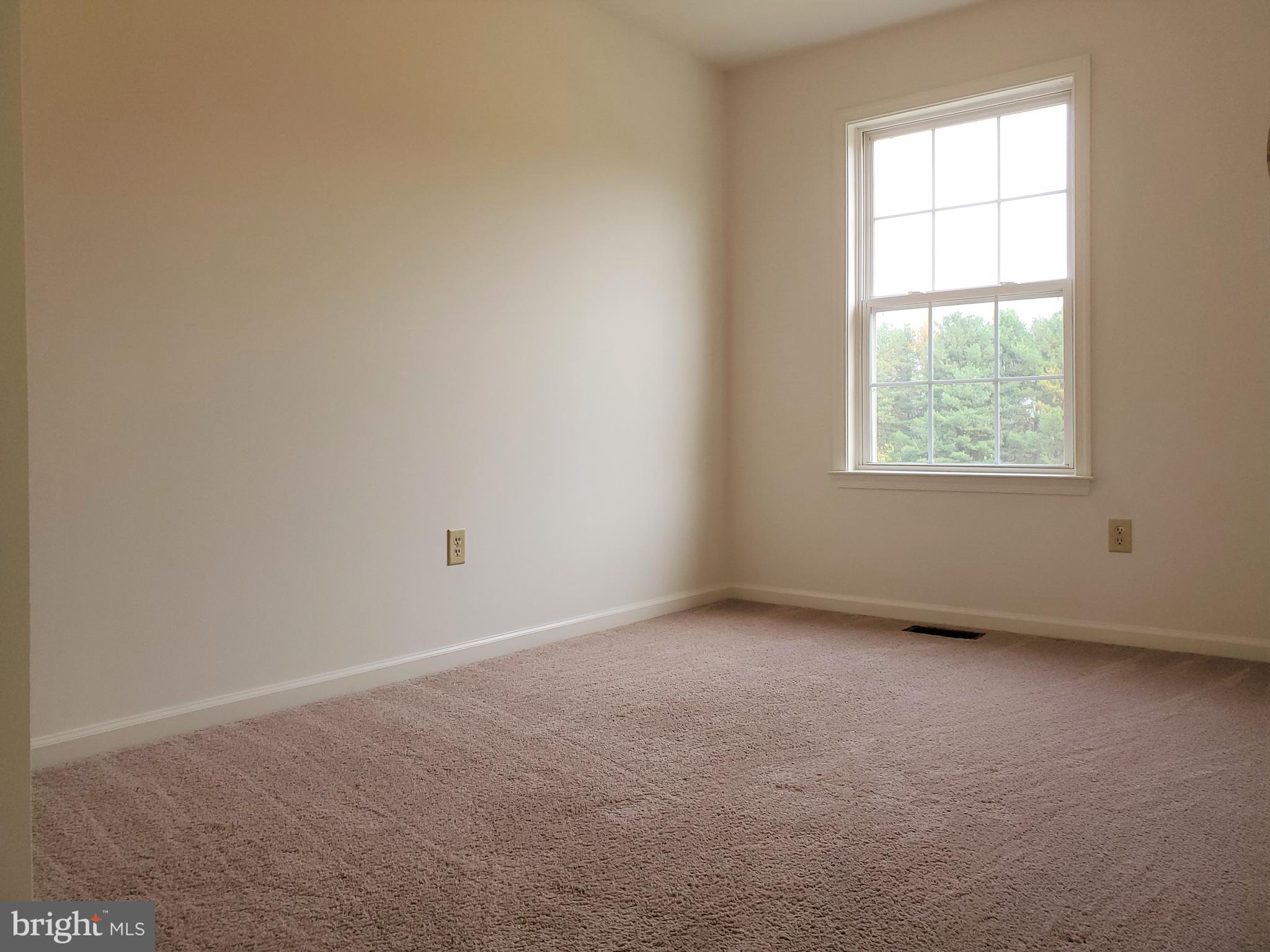 211 Bonnybrook Road Middletown, DE 19709 - Photo 12 of 16 an empty room with windows