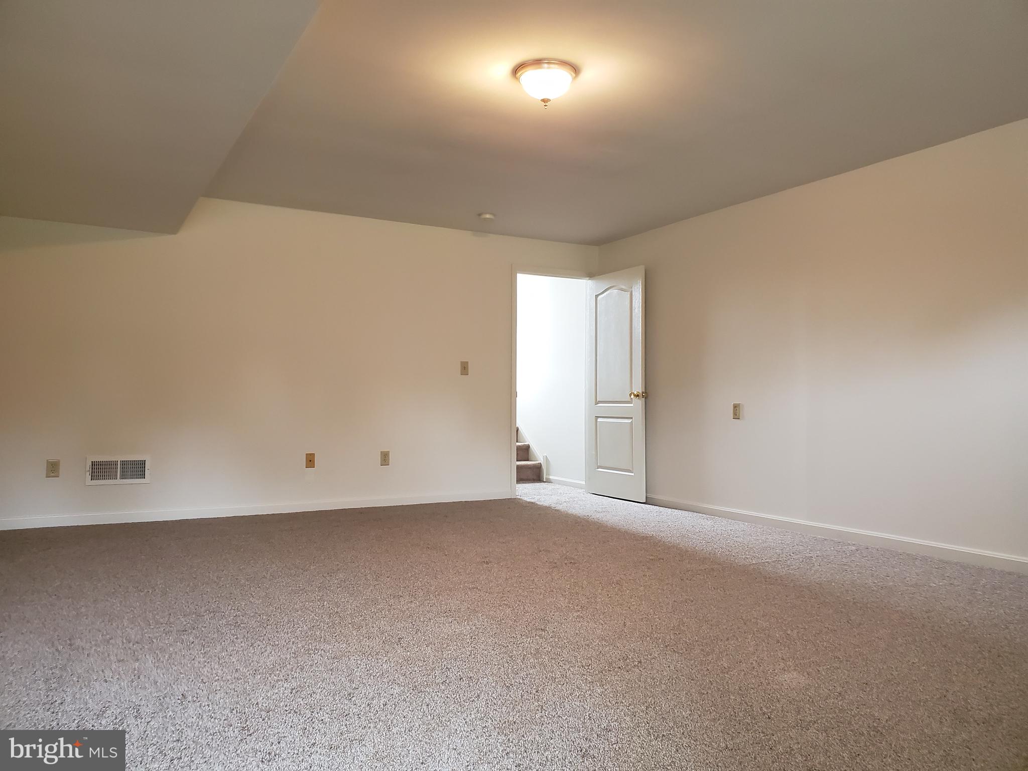 211 Bonnybrook Road Middletown, DE 19709 - Photo 2 of 16 a view of an empty room and a window