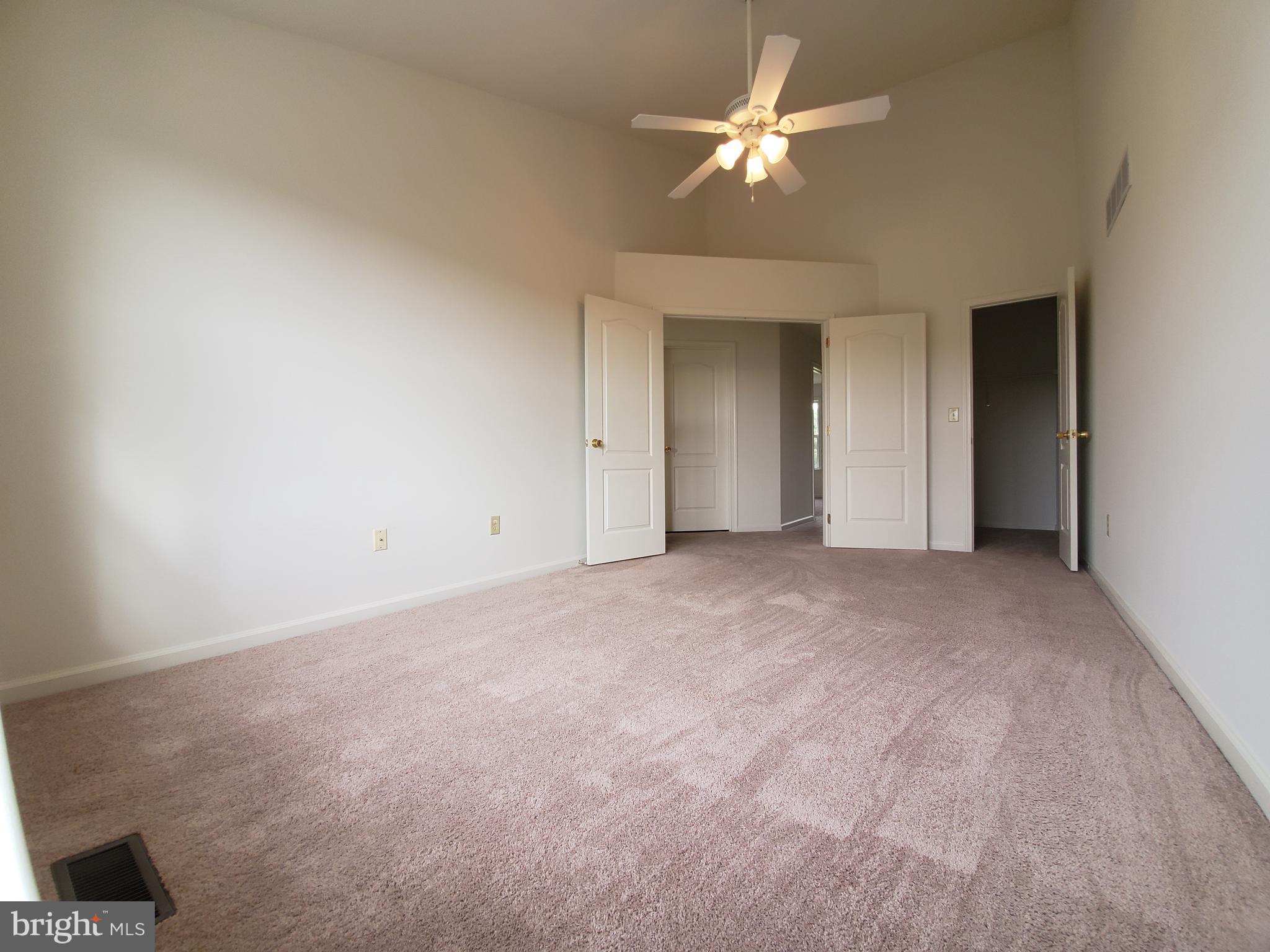 211 Bonnybrook Road Middletown, DE 19709 - Photo 10 of 16 a view of an empty room with a ceiling fan