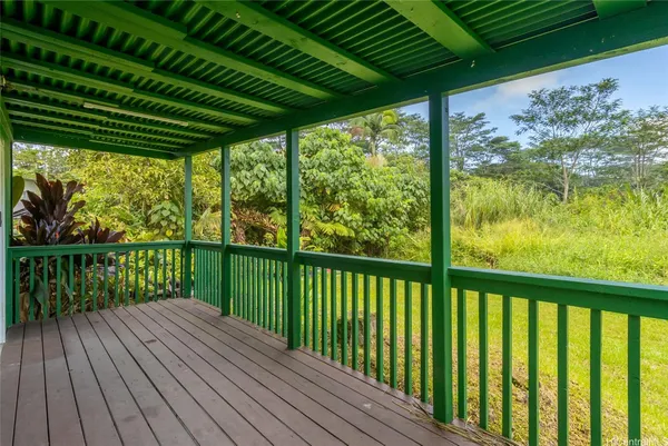 a view of balcony with wooden floor