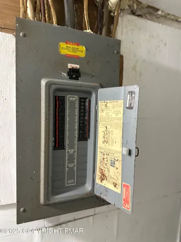 a view of house with yard and sitting area