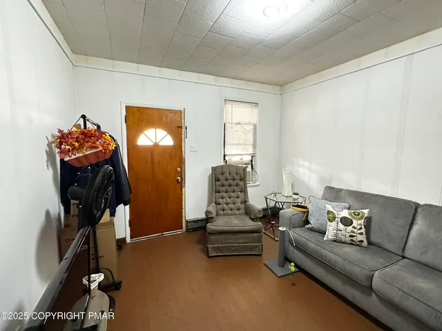 a view of entryway with wooden floor