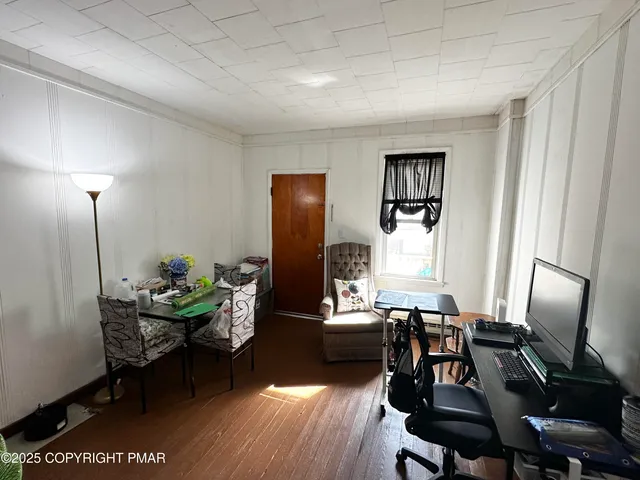 a bedroom with furniture and a window