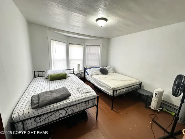 a bedroom with a bed and furniture