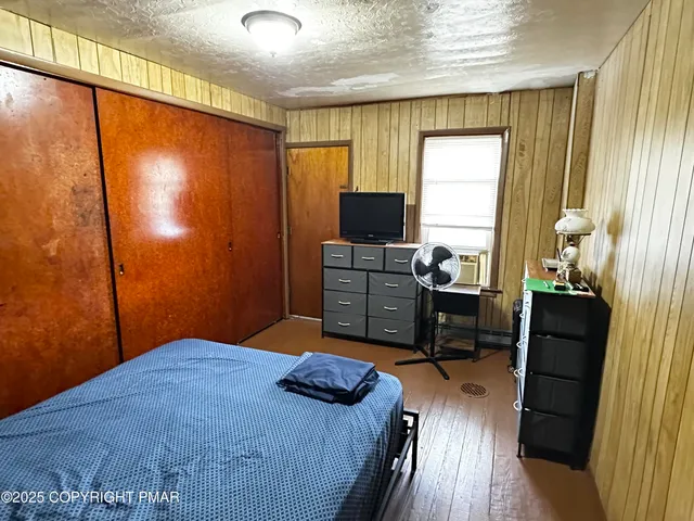 a view of a hardwood floor and staircase