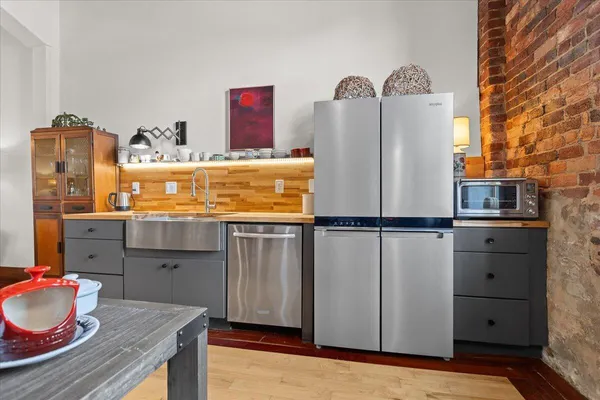 a kitchen with refrigerator and washer