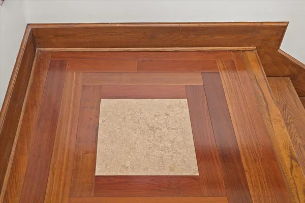 a view of an entryway with wooden floor and windows