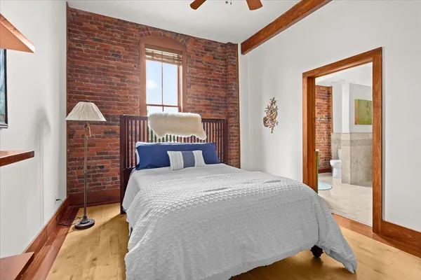 a bedroom with a bed and a cabinets