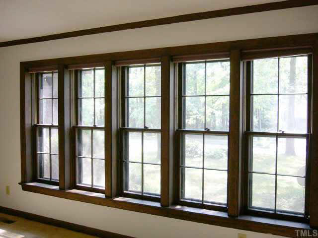 7121 Brecken Ridge Avenue Raleigh, NC 27615 - Photo 8 of 9 Wall of windows in the formal Living room