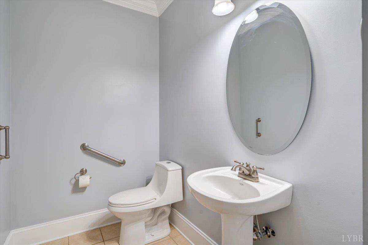 1250 Our Cove Road Huddleston, VA 24104 - Photo 28 of 70 a bathroom with a sink mirror and toilet