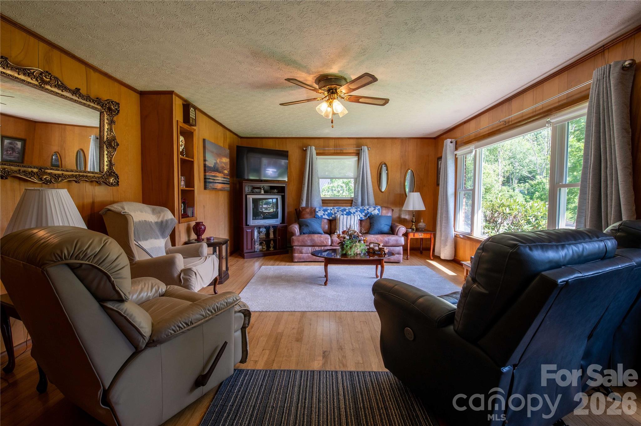 40 Double Island Road Burnsville, NC 28714 - Photo 13 of 38 a living room with furniture and a large window
