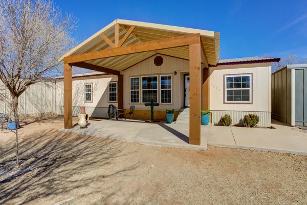 a view of a house with snow on the road
