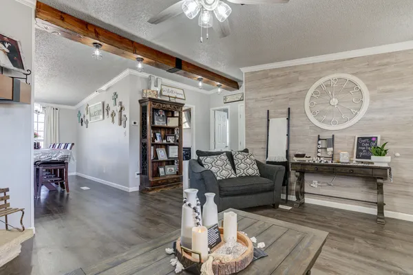 a kitchen with stainless steel appliances kitchen island granite countertop a refrigerator and a stove