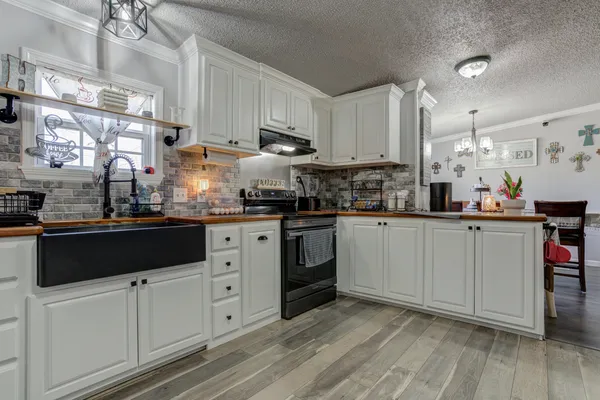 a bathroom with a sink and mirror with toilet