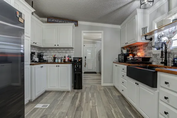 a view of a porch with a table and chairs