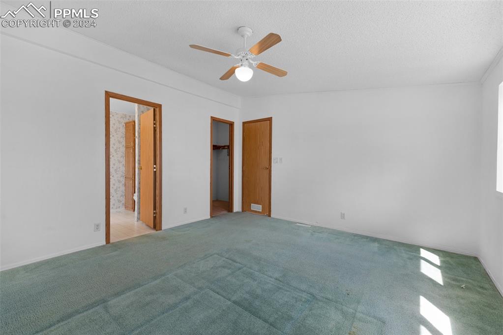 33510 Fossinger Road Yoder, CO 80864 - Photo 5 of 50 a view of an empty room with ceiling fan