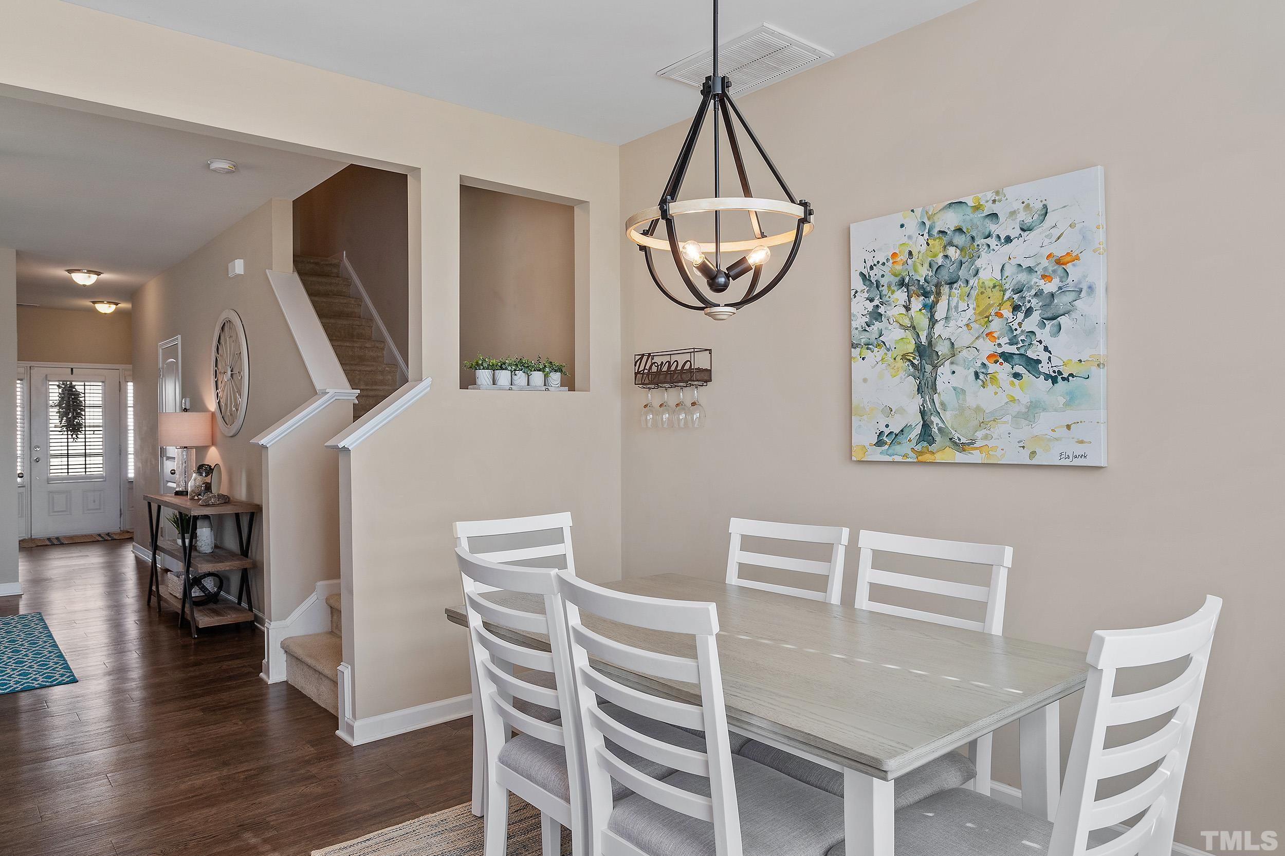 1014 Grand Ridge Drive Rolesville, NC 27571 - Photo 9 of 18 a view of a dining room with furniture