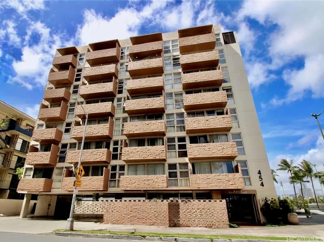 a front view of a building with a street