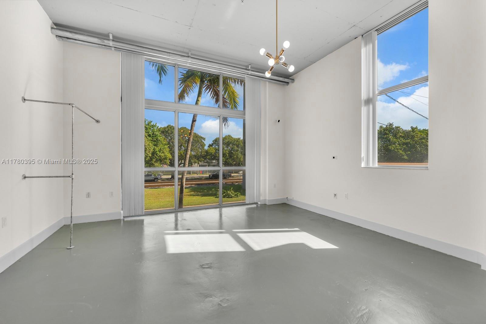 2100 Van Buren Street, Unit 206 Hollywood, FL 33020 - Photo 6 of 17 a view of an empty room with a window