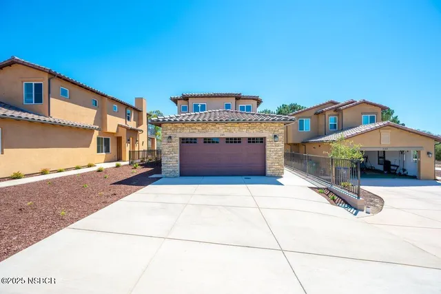 a front view of building with yard