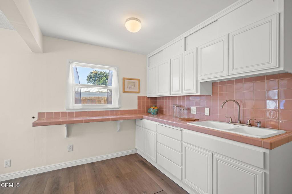 4025 Maxson Road El Monte, CA 91732 - Photo 11 of 27 a kitchen with a sink cabinets and wooden floor