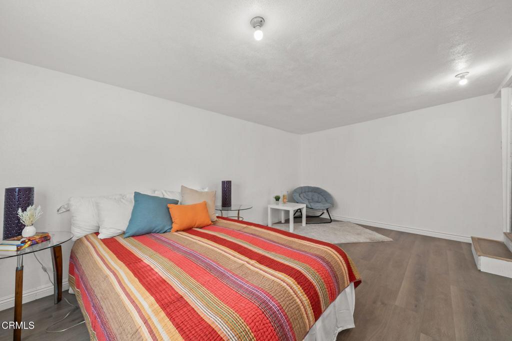 4025 Maxson Road El Monte, CA 91732 - Photo 15 of 27 a bedroom with bed and wooden floor
